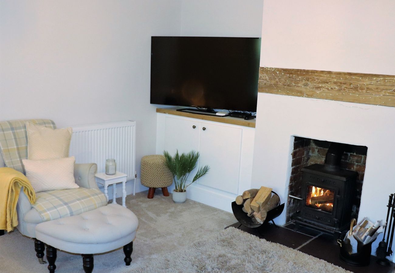 Warm and inviting lounge with log burner