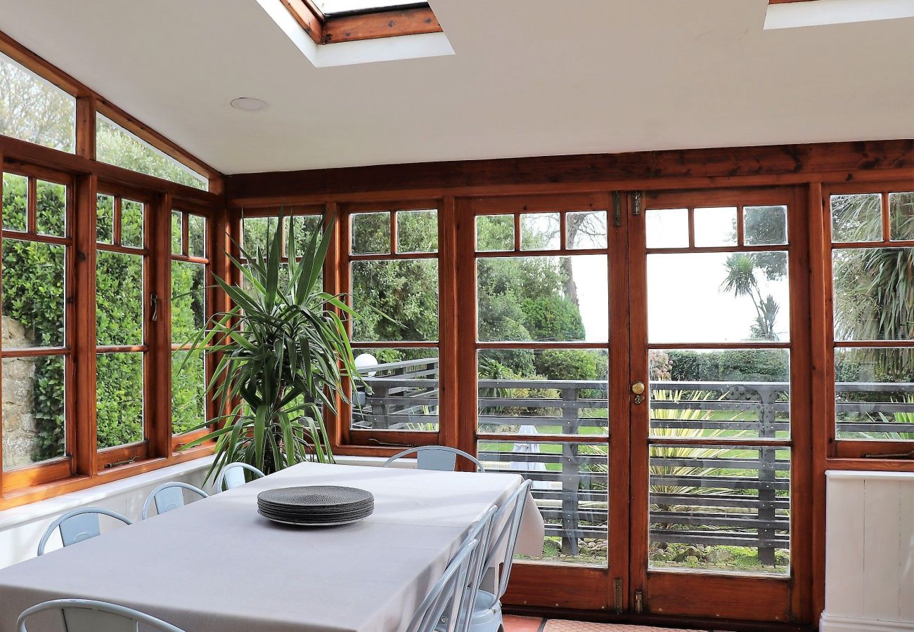 Pet friendly and family dining area in light and bright conservatory 