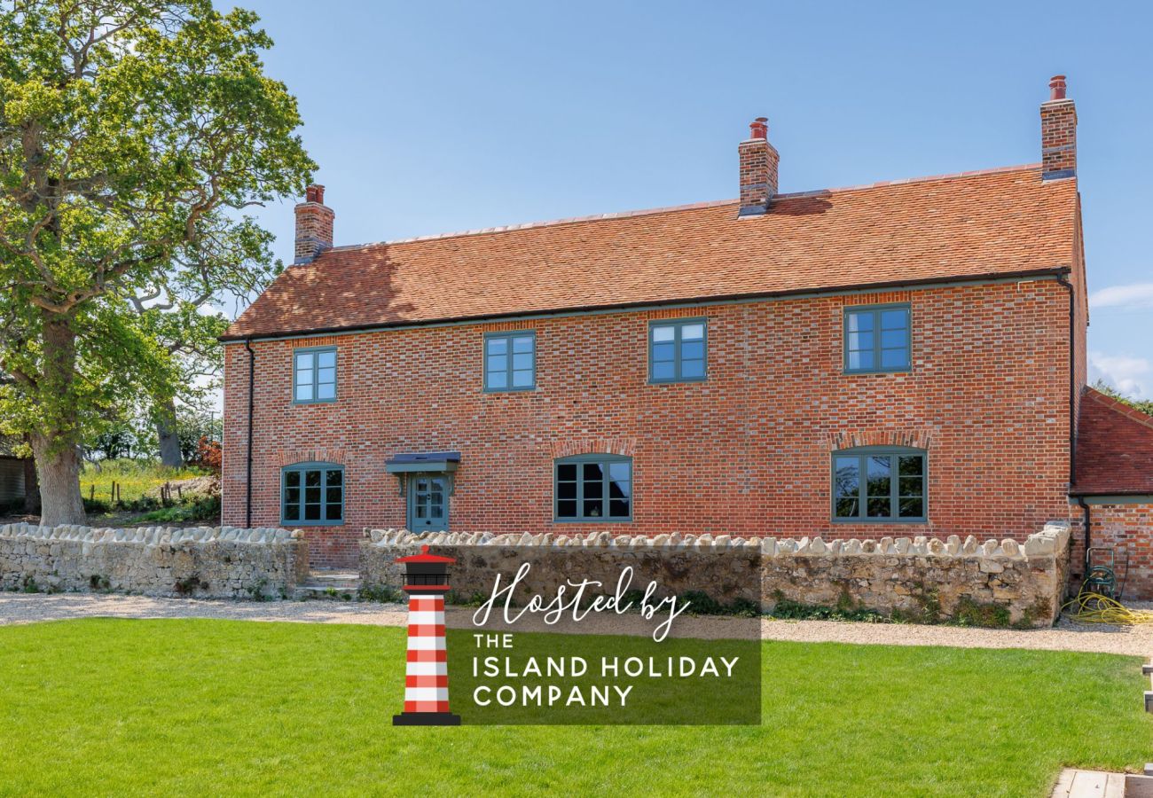 Exterior of The Farmhouse at Nunwell, a spacious renovated farmhouse on the Isle of Wight