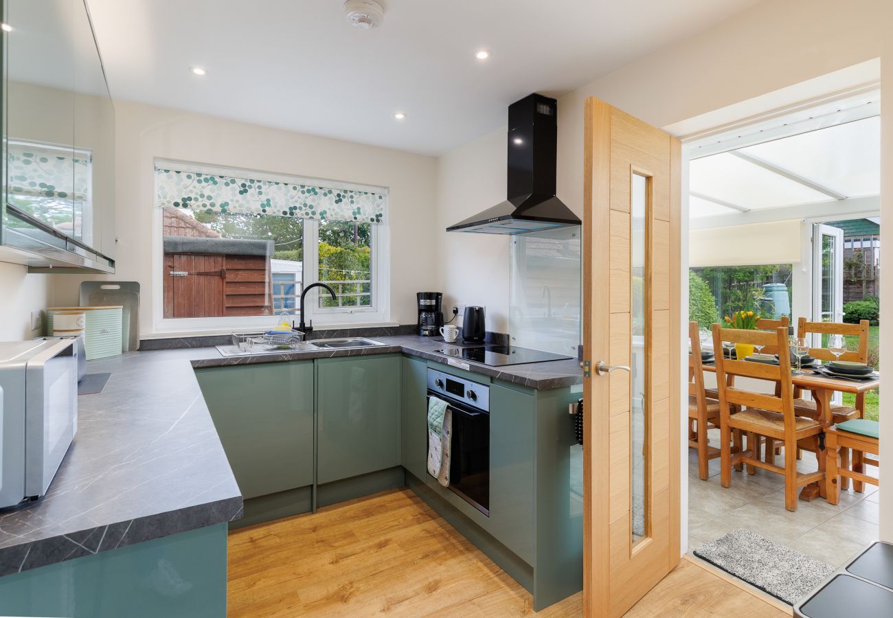 Kitchen and dining room in modern coastal holiday home interior