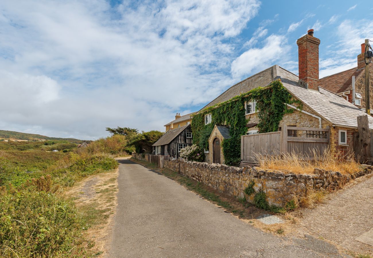 Exterior of Moon Chine Cottage surrounded by peaceful countryside on the Isle of Wight.