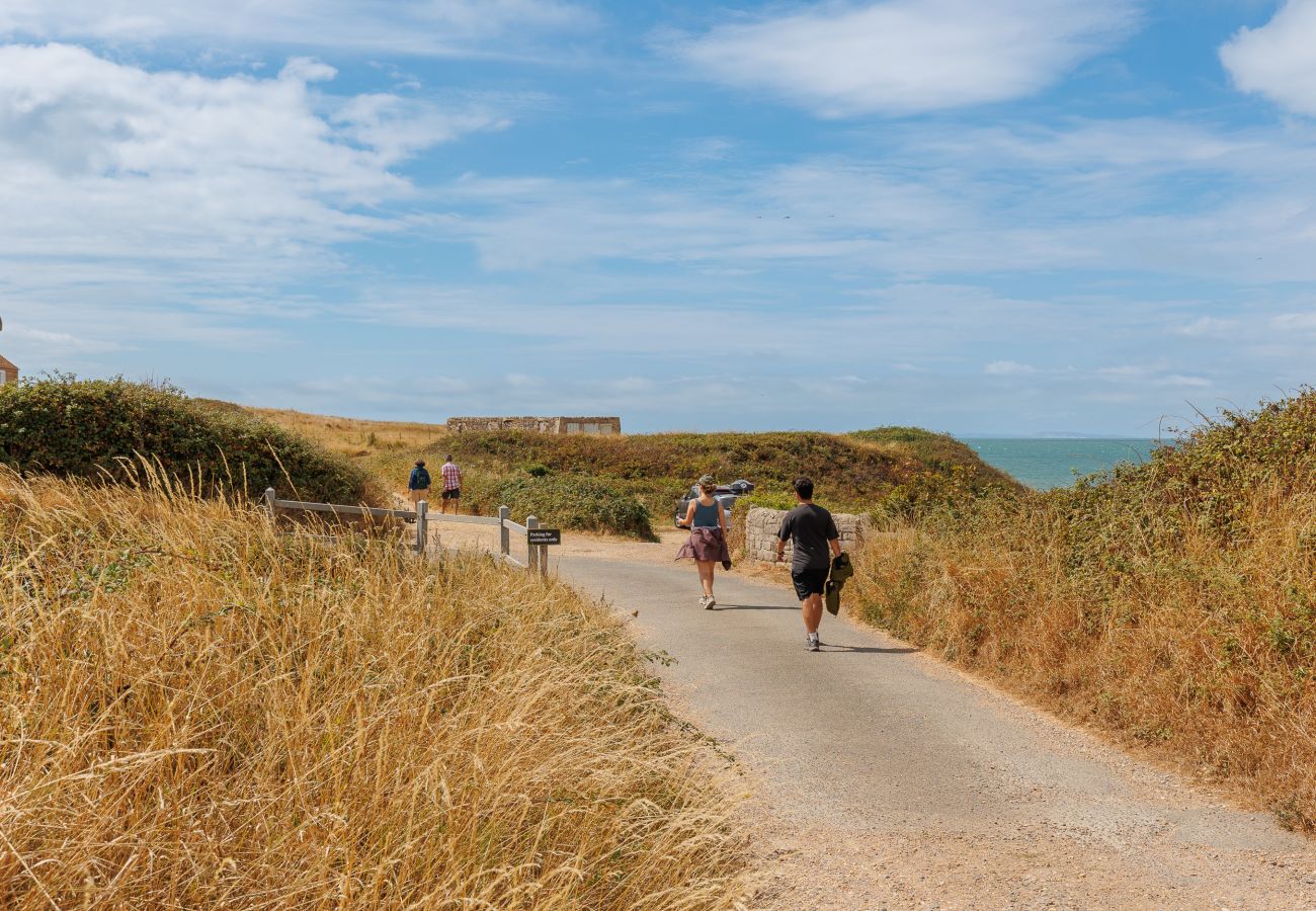 Walkers enjoying the coastal path near Moon Chine Cottage on the Isle of Wight.