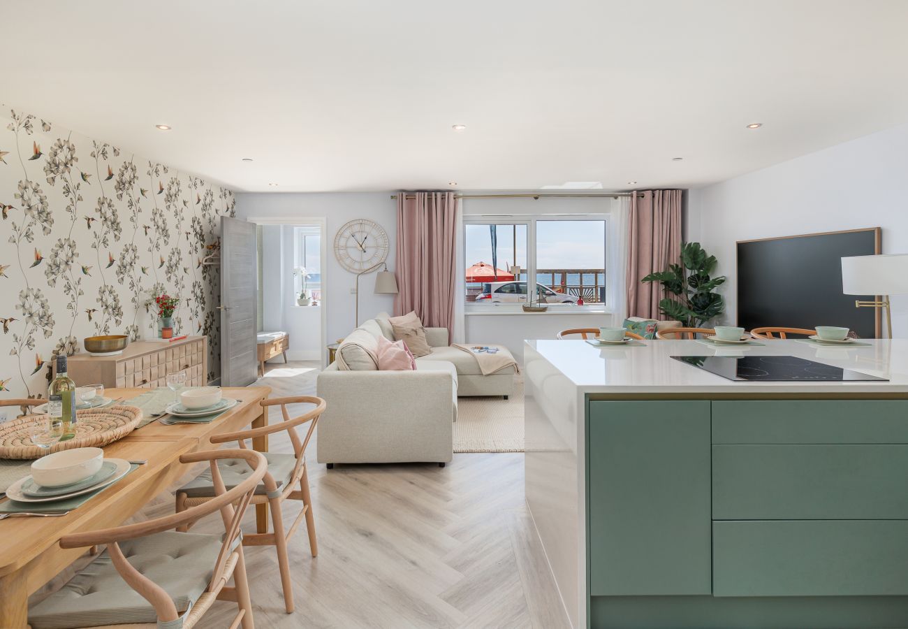 Open-plan kitchen, dining and living area at Hummingbird ground-floor apartment on Sandown seafront, Isle of Wight.