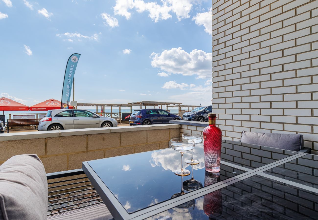 Outside seating area at Hummingbird with table and chairs overlooking Sandown seafront.