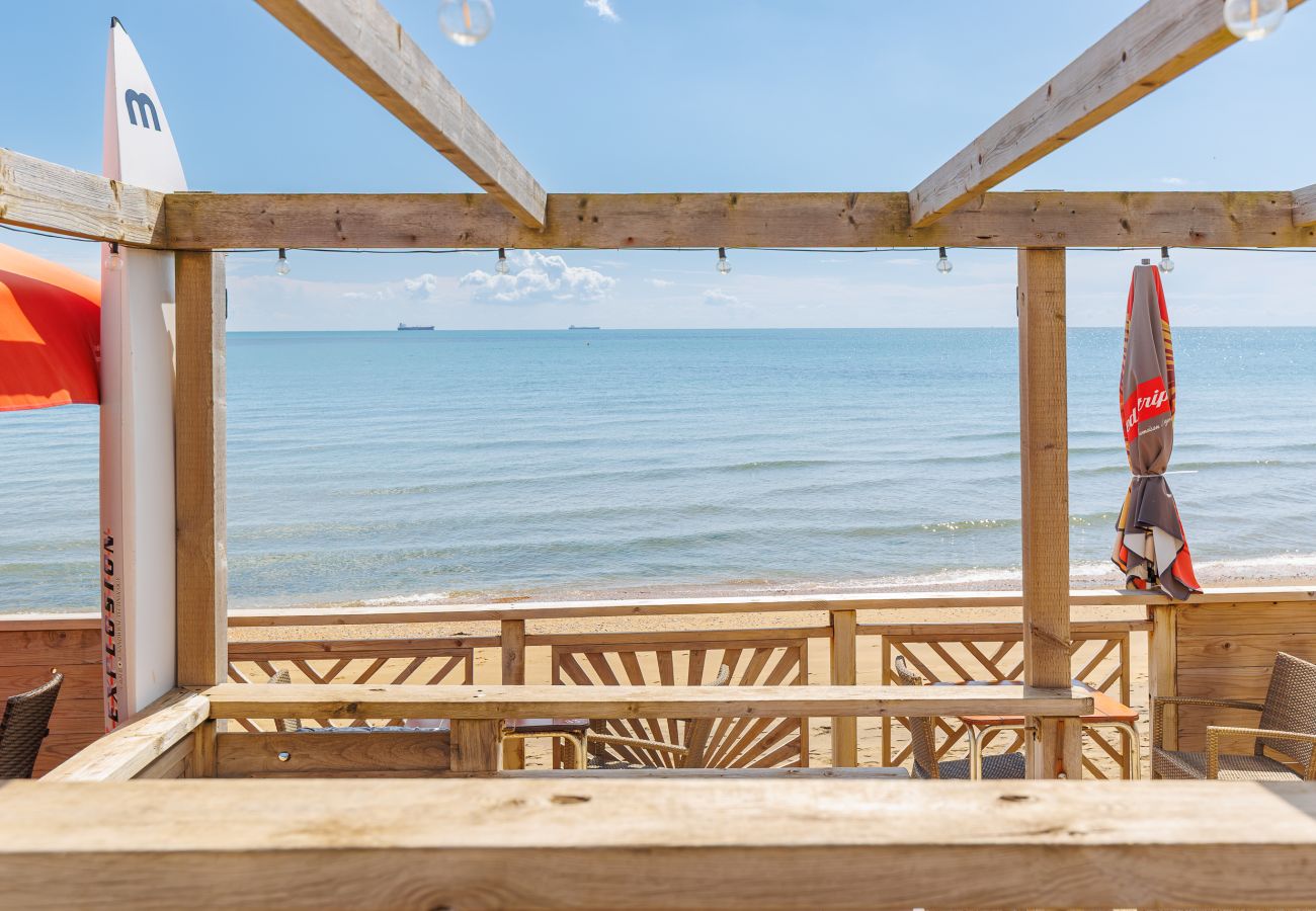 View across the sea and Sandown Bay from Driftwood Beach Bar, seen from across the road.