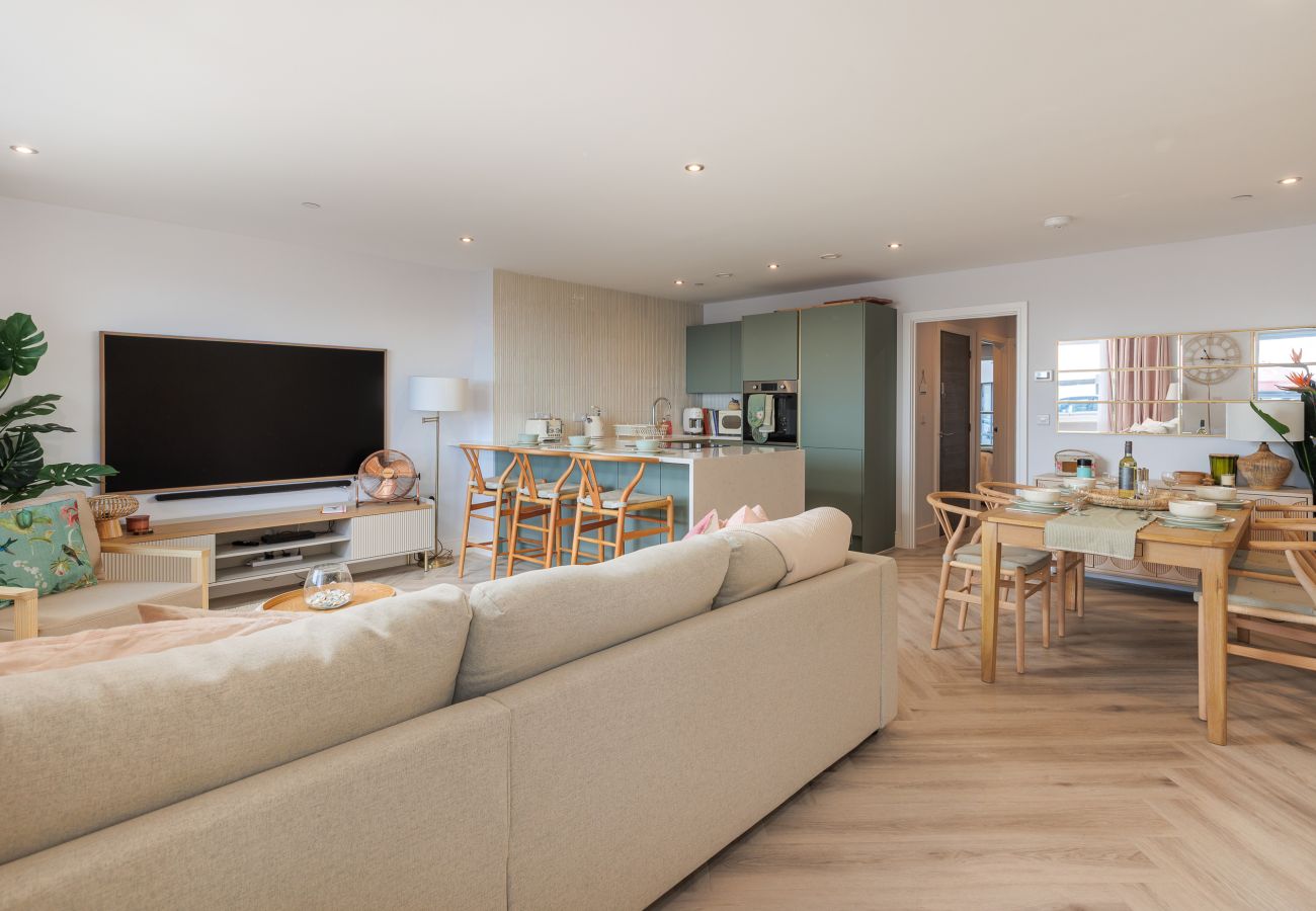 Open-plan kitchen, dining and living room at Hummingbird, a two-bedroom ground-floor apartment on Sandown seafront.