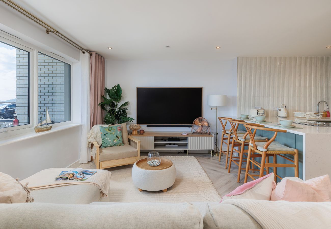 Bright and comfortable living room at Hummingbird, a two-bedroom ground-floor apartment on Sandown seafront.