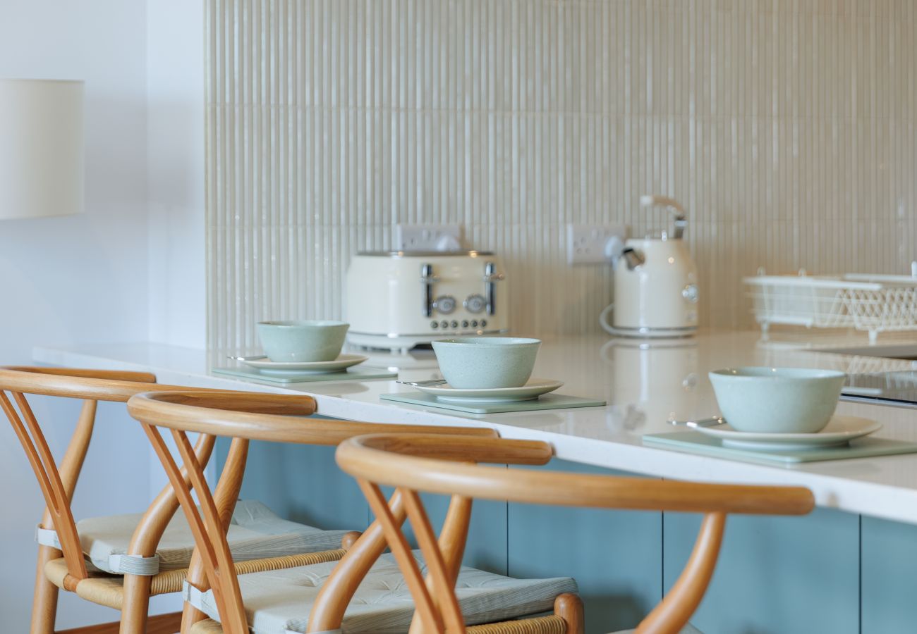 Breakfast bar in the open-plan kitchen at Hummingbird, a two-bedroom ground-floor apartment on Sandown seafront.