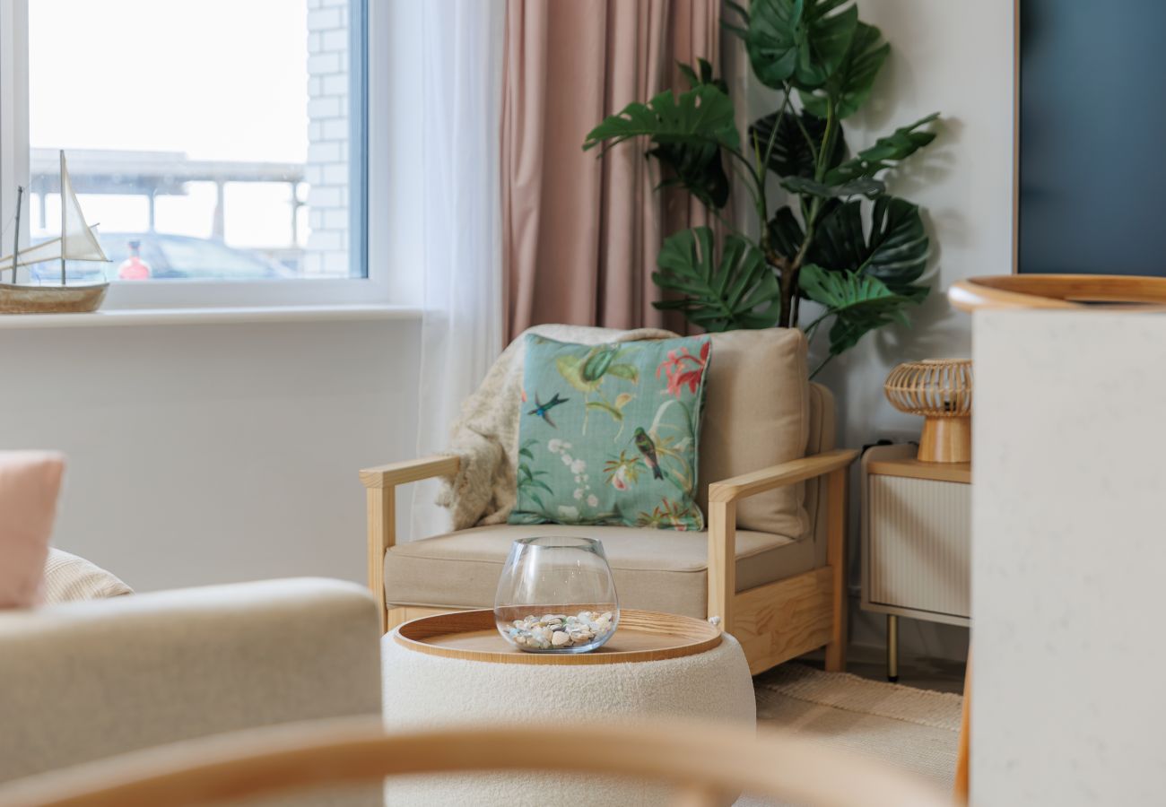 Cosy seating area in the living room at Hummingbird, a ground-floor apartment on Sandown seafront.